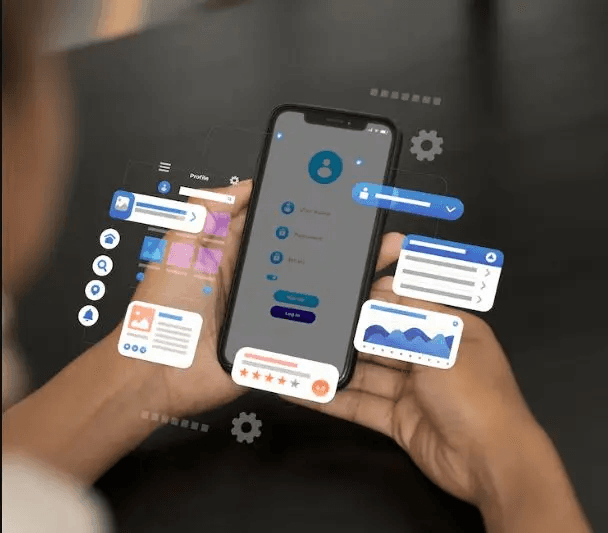 Équipe technique analysant les performances pour la maintenance d'application mobile
